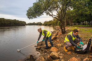 EPA officers sampling water from a river
