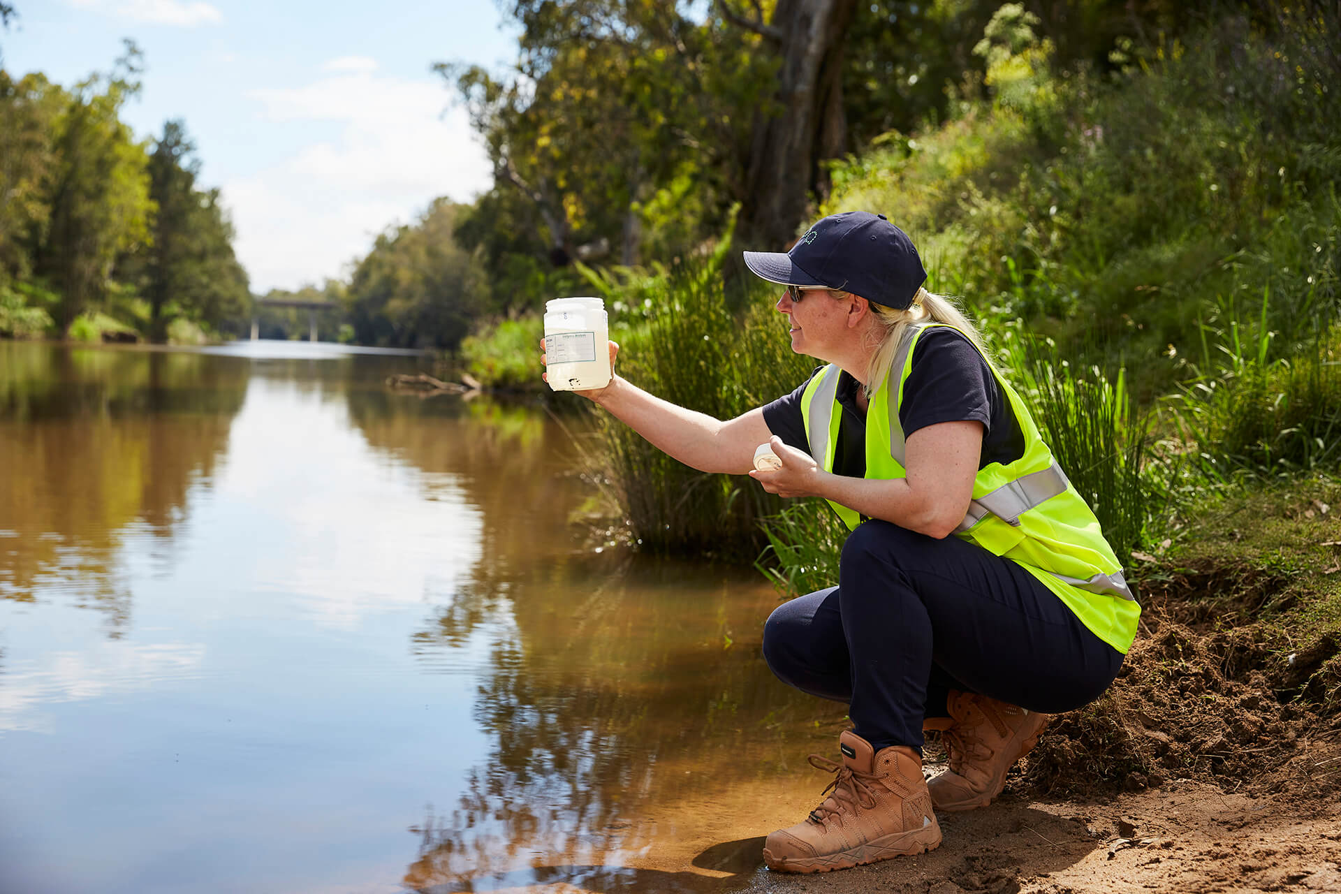 EPA officer taking water sample