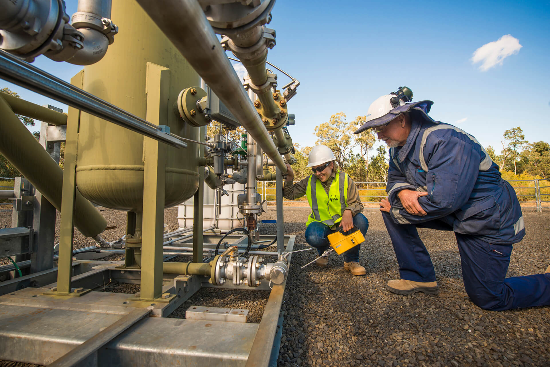 EPA officer and client inspecting gas pipeline