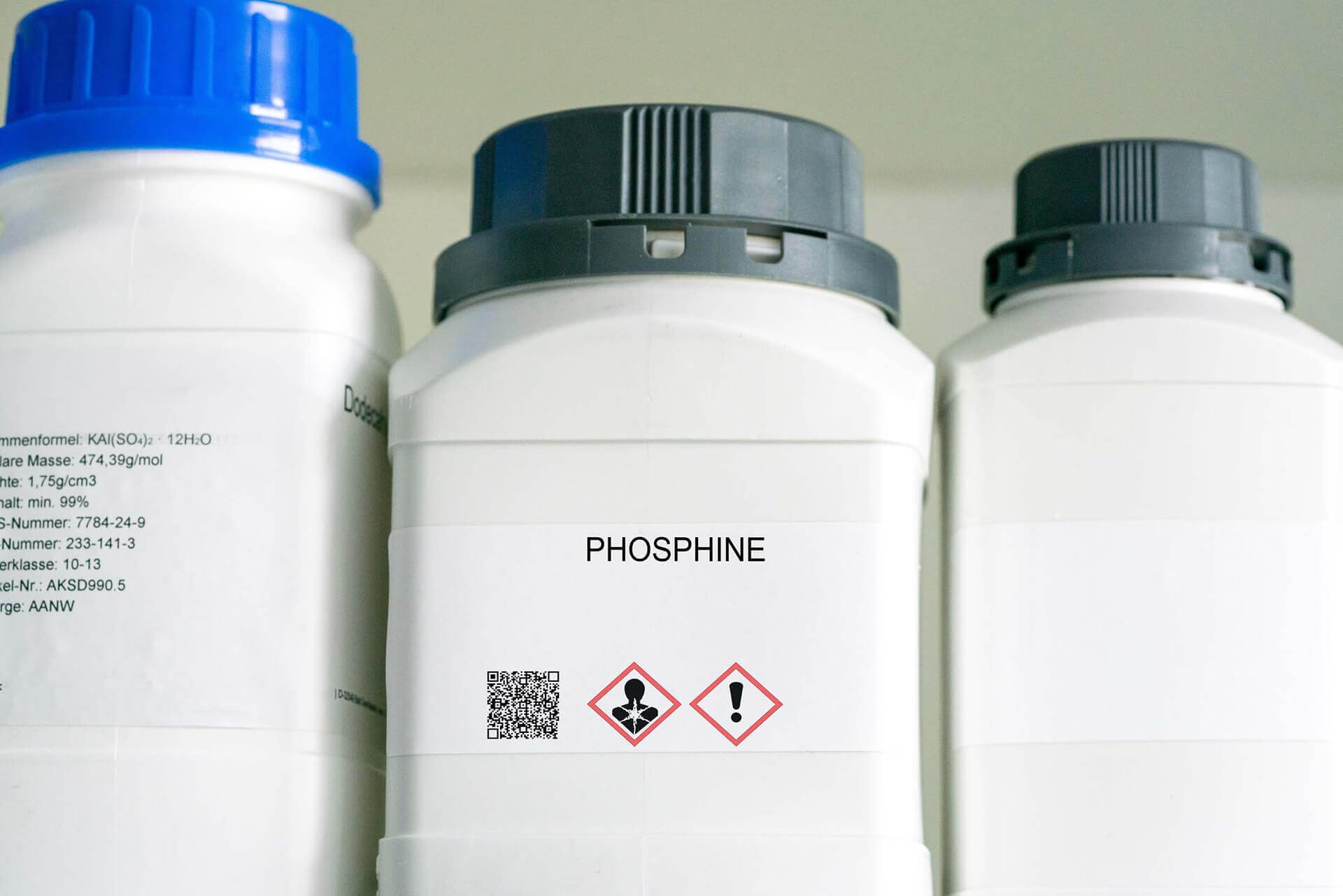 Phosphine stored in a white laboratory container with black lid