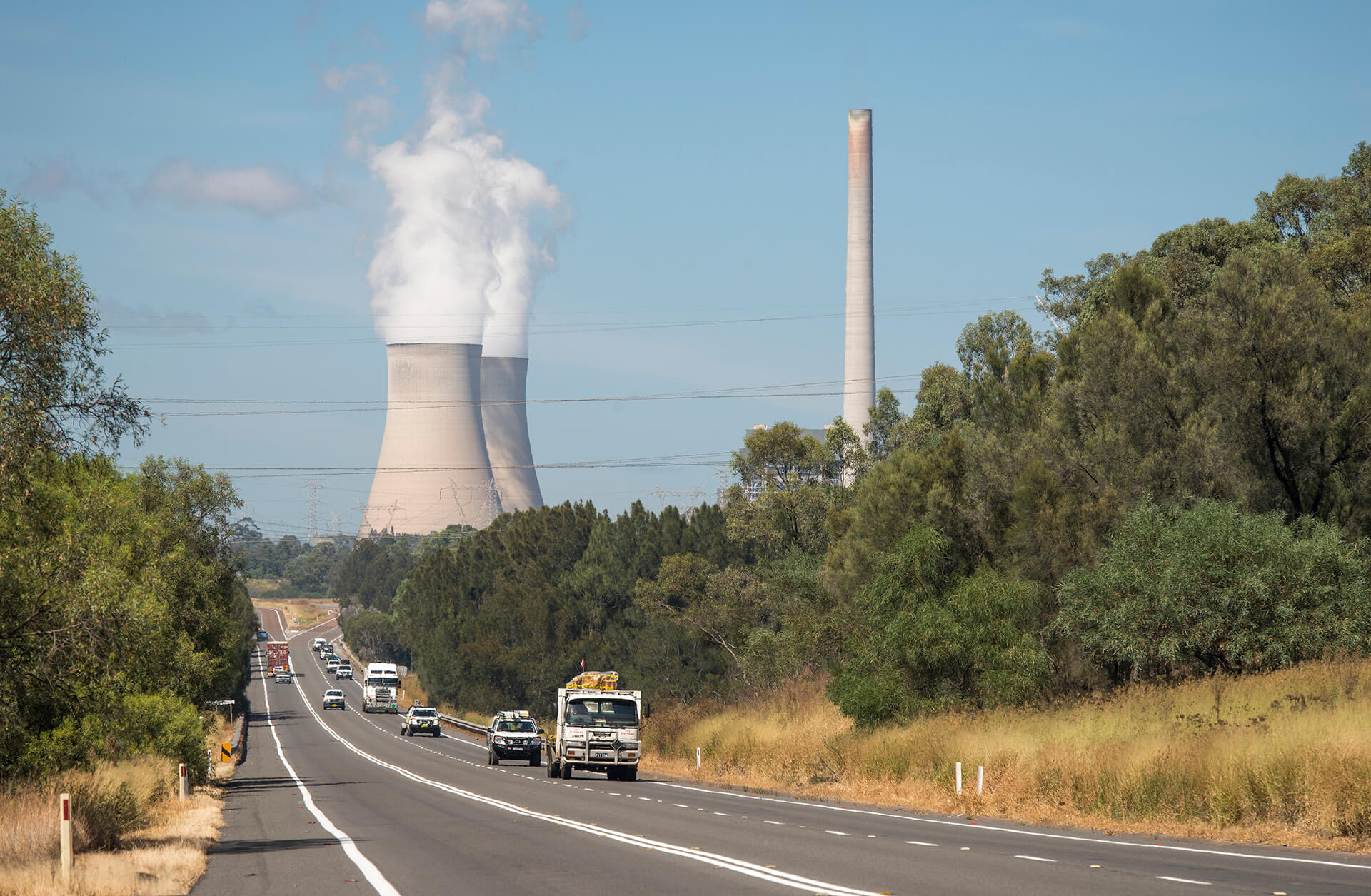 Power station with traffic in the foreground