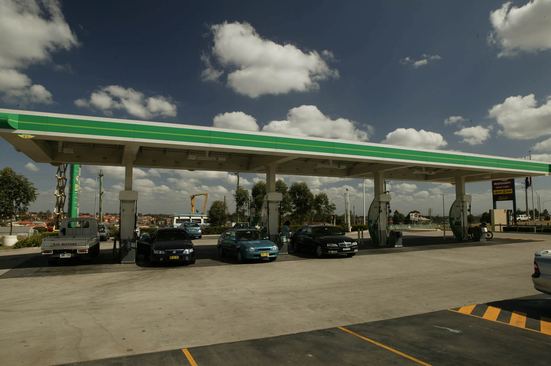 Service station with vehicles being fuelled