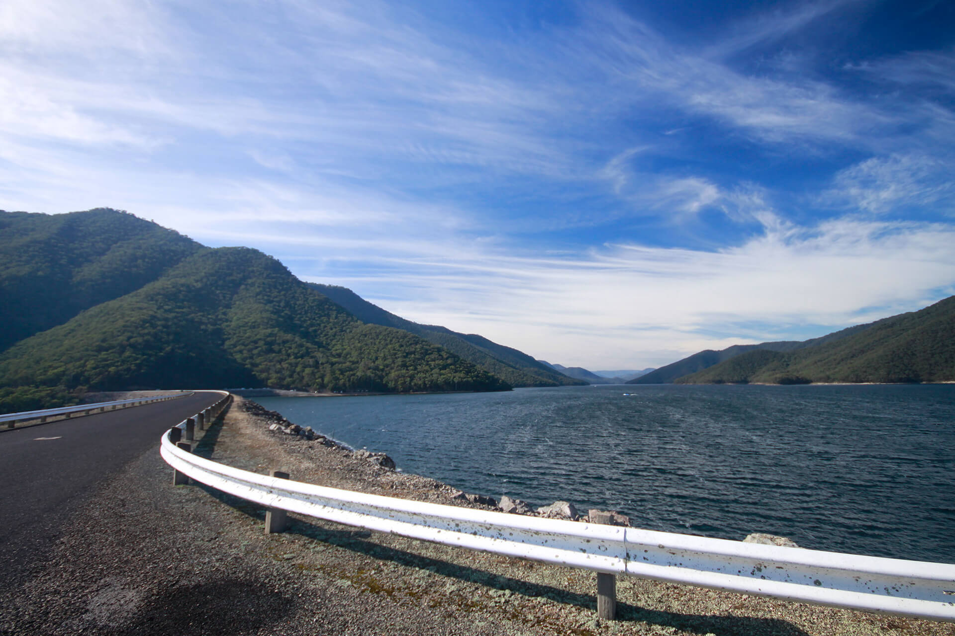 Talbingo Dam wall with mountains and dam in the background