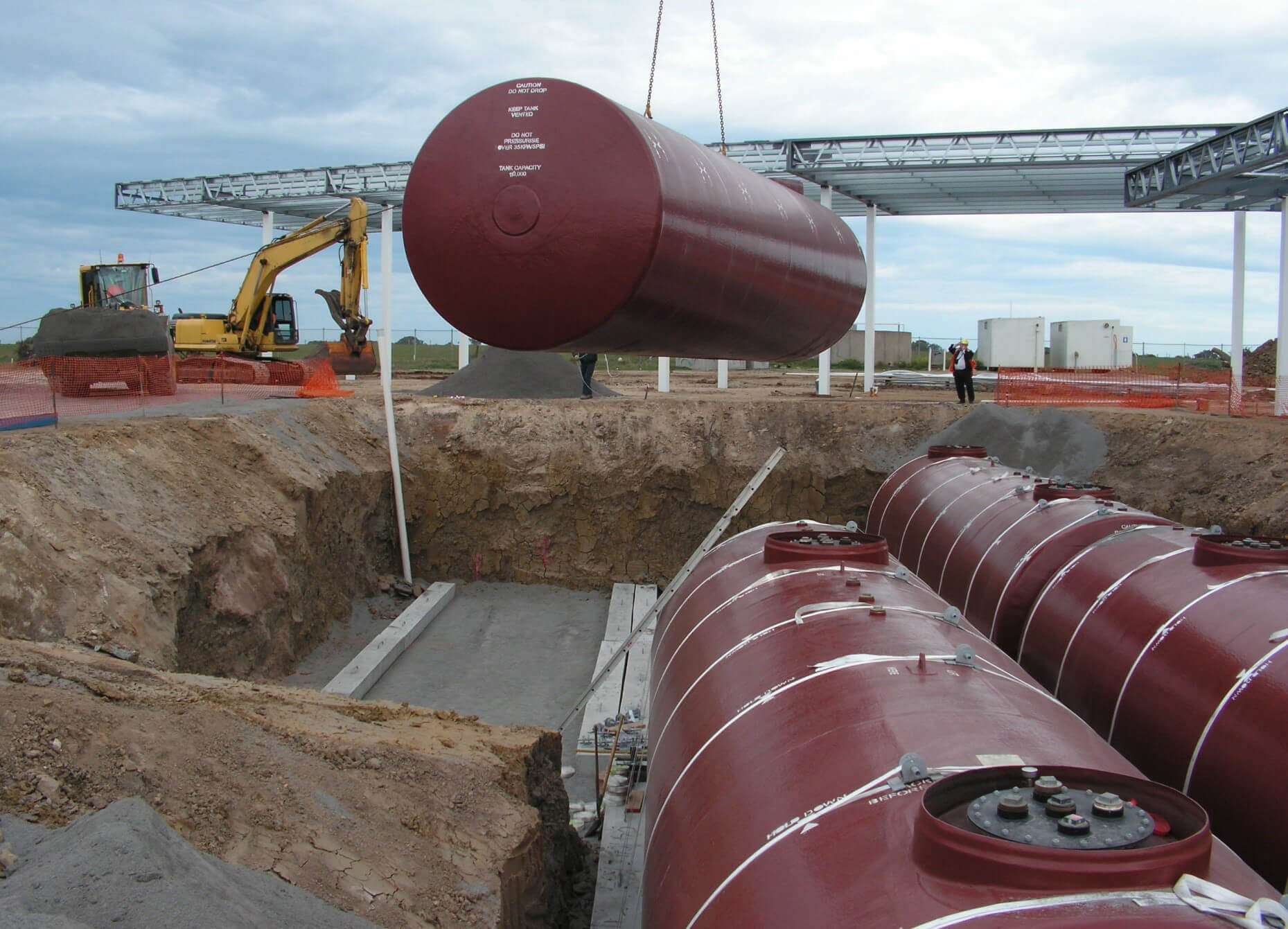 Underground petroleum storage tanks being installed