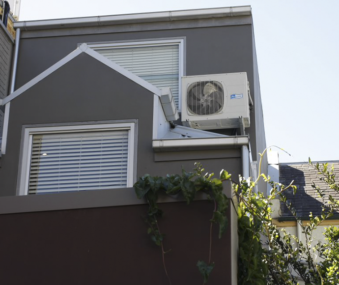 Air conditioning unit outside a house