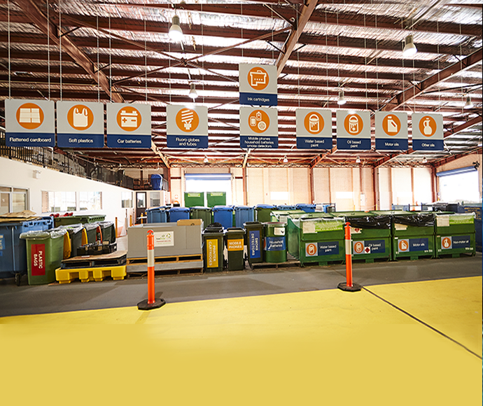 Hornsby community recycling centre showing storage bins and recycling signs