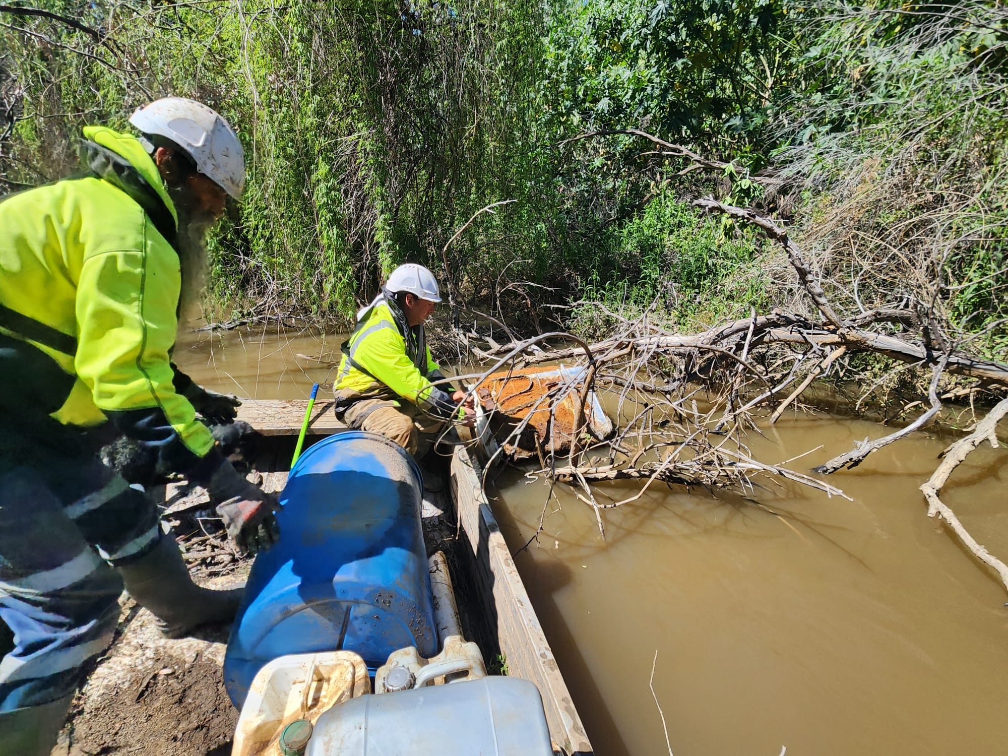 Crew removing debris during river sweeps, Warren